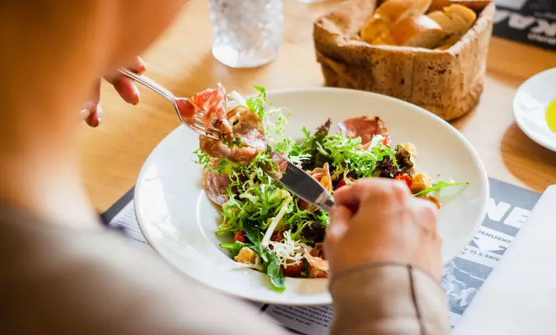 a guy having salad lunch