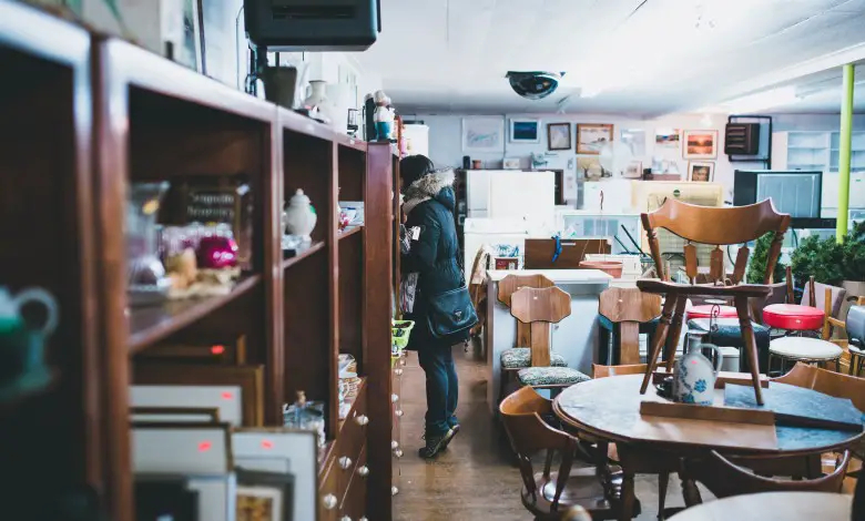 women standing in thrift store