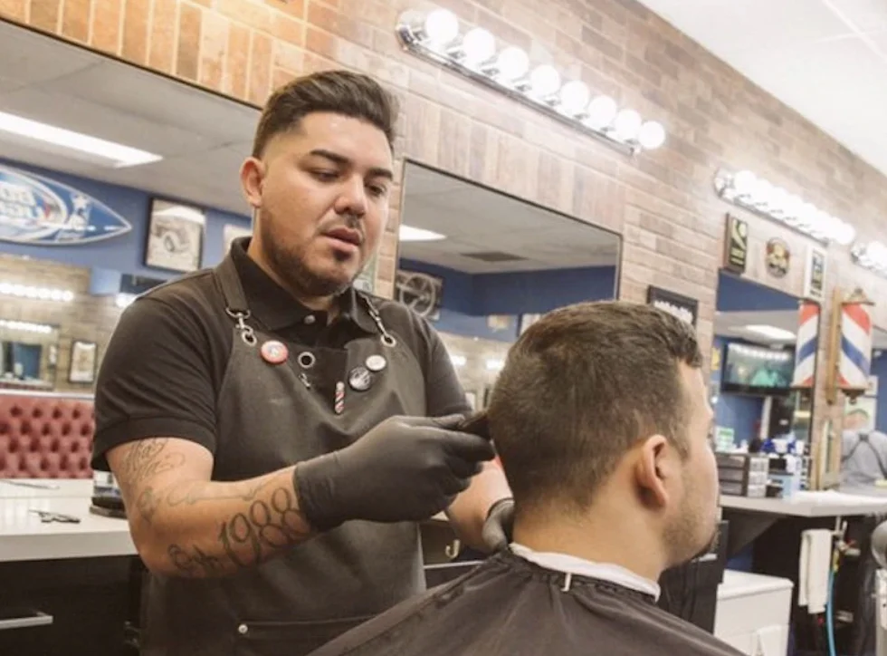 guy getting haircut at Anaheim Shave Parlor