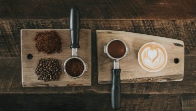 coffee beans beside coffee powder