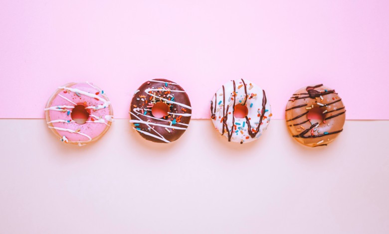 4 donuts pink background
