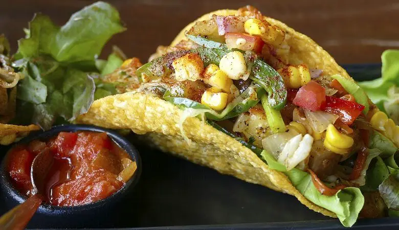 hard shell taco with corn and sauce