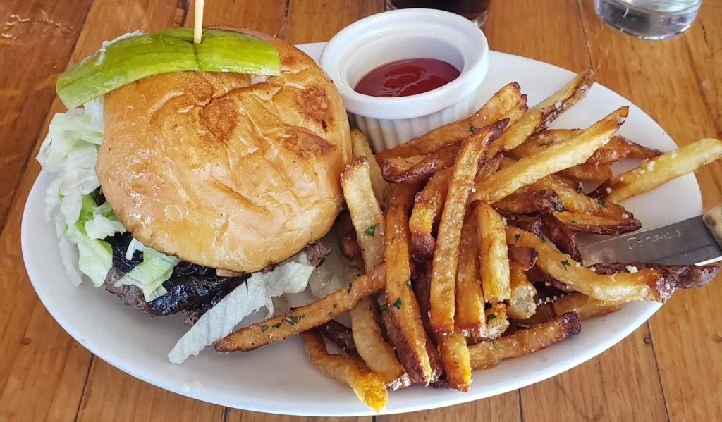 burger, fries and sauce on a plate