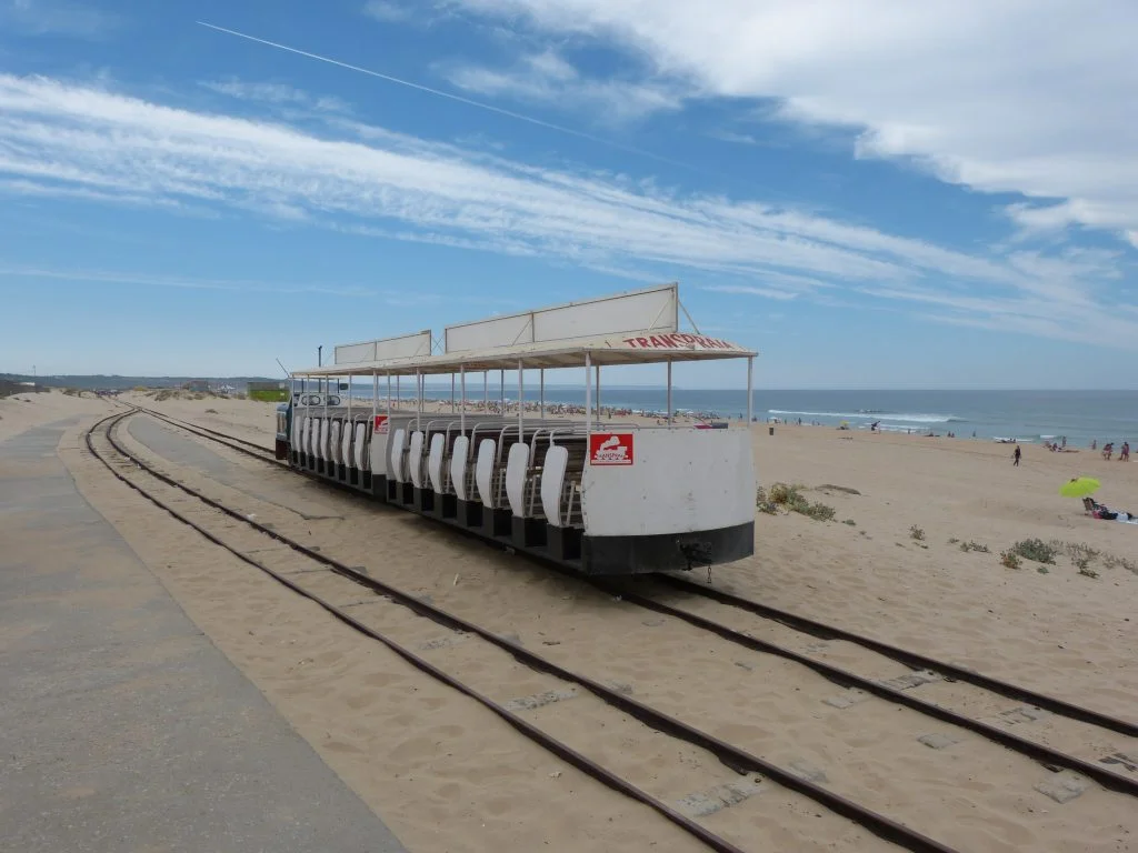 Costa da Caparica empty rail train with beach