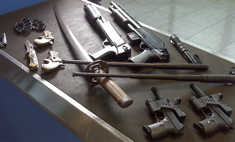 weapons at airport. Katana, glock, shotgun etc