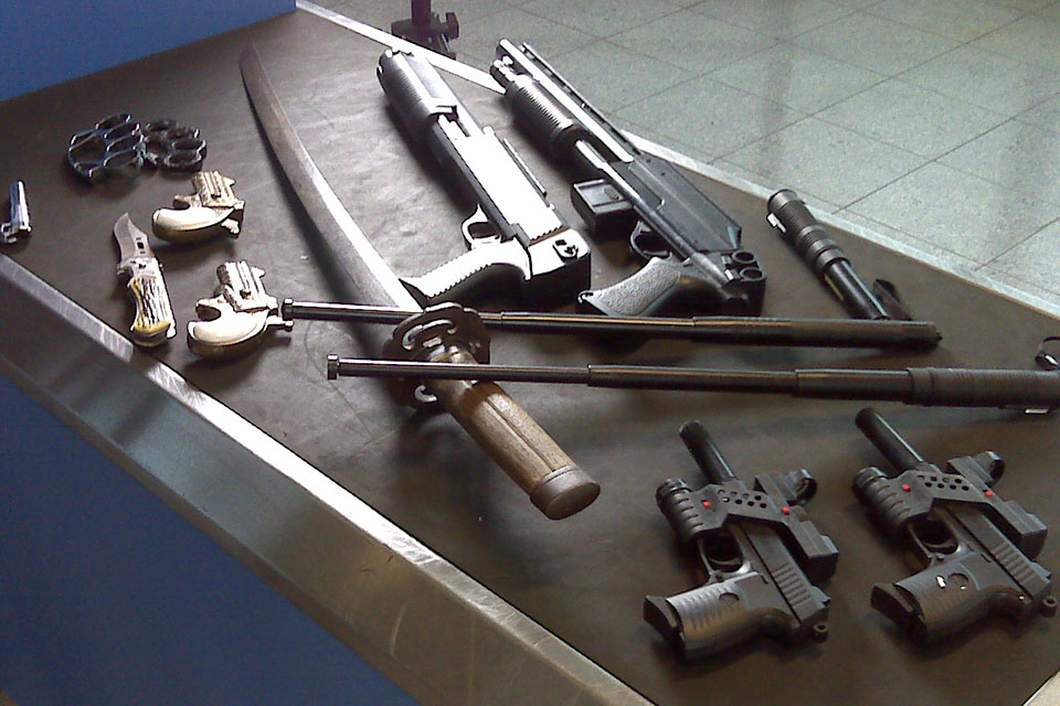 weapons at airport. Katana, glock, shotgun etc