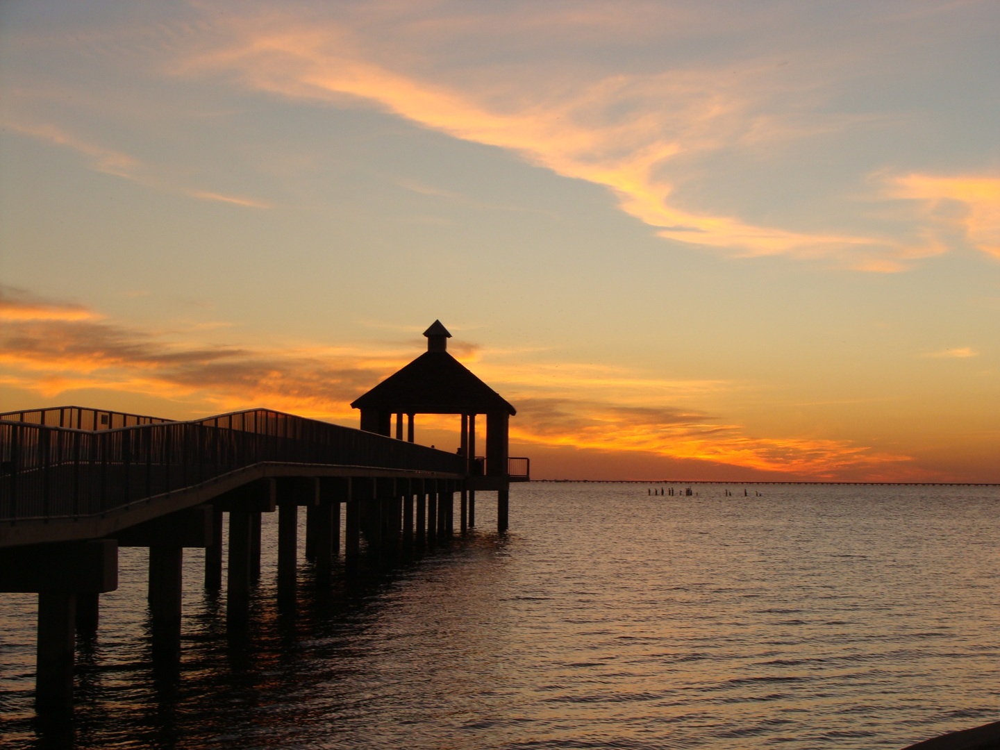 beach broadwalk and orange sunset