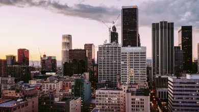 Sunset with streak of clouds covers the downtown Los Angeles sky, above One Wilshire Building and City National Bank. Original public domain image from Wikimedia Commons