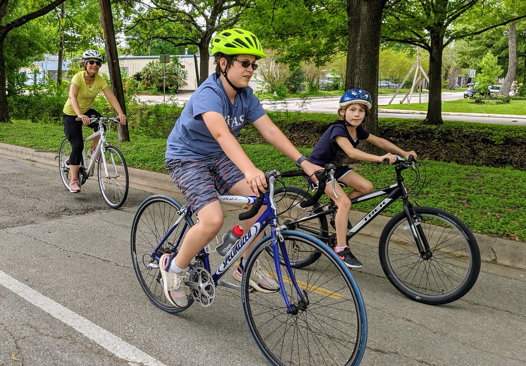 A family riding a bike