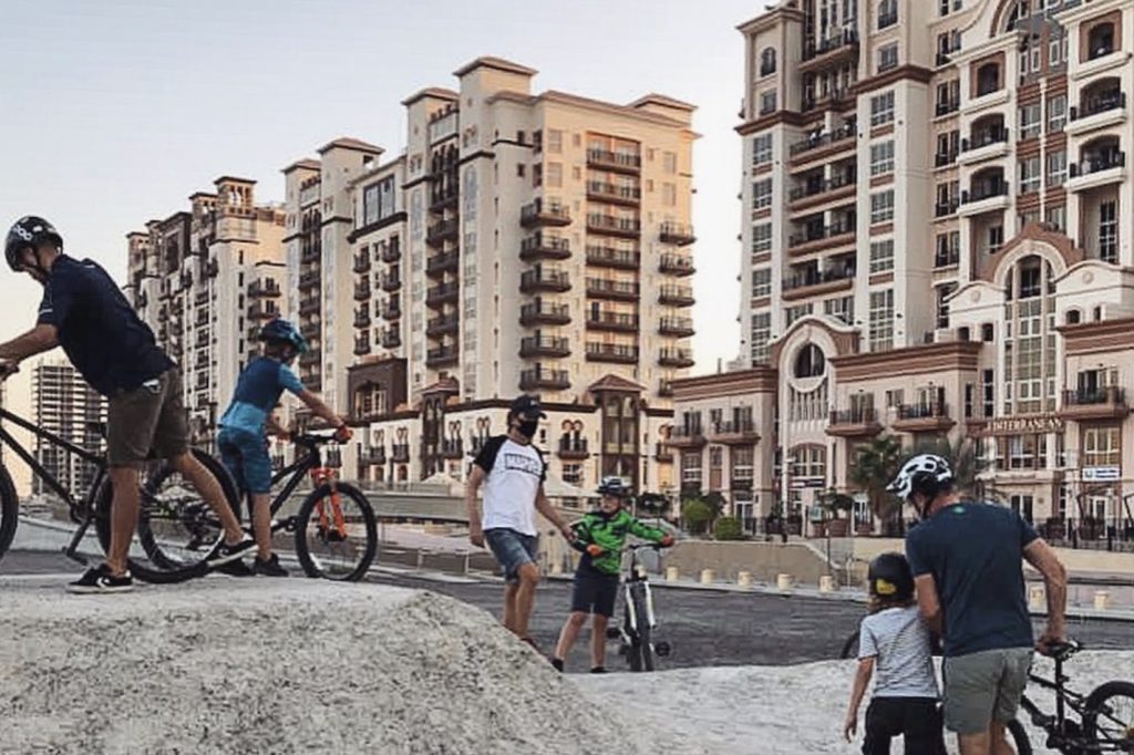 kids cycling at dubai sports city
