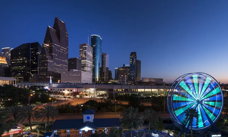 Dusk shot of Houston, taken from the Downtown Aquarium. The spinning wheel at the right is the aquarium's Ferris wheel