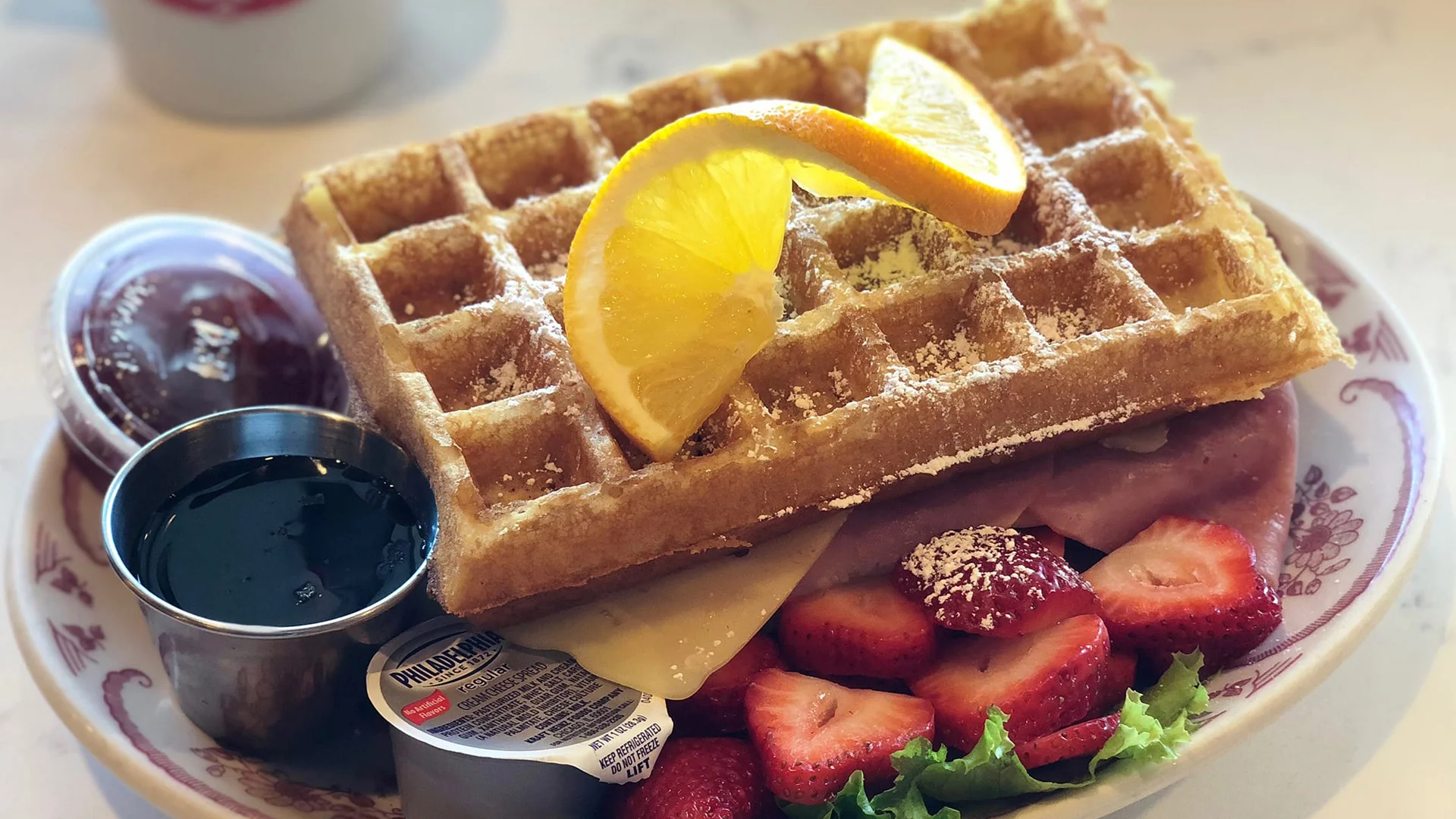 Delicious waffle with strawberries