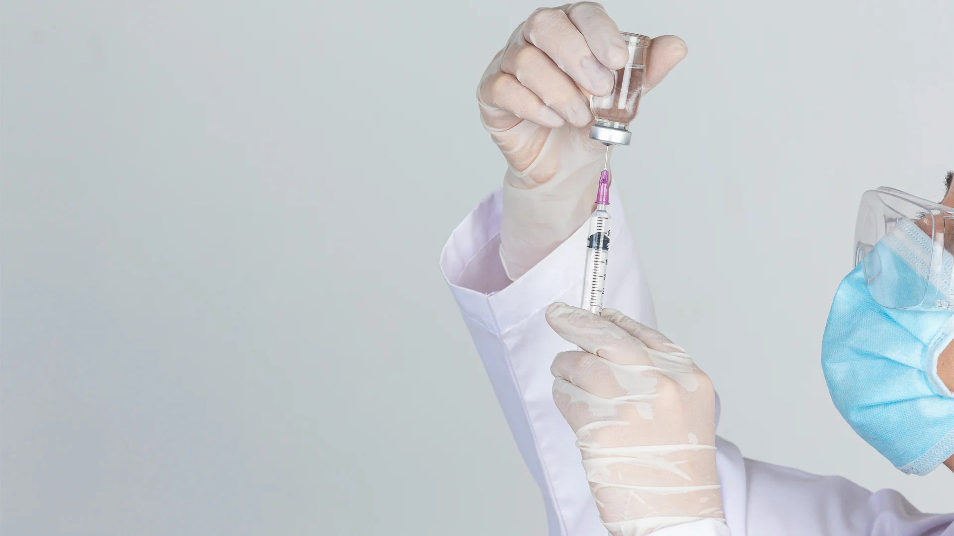 Doctor drawing insulin syringe