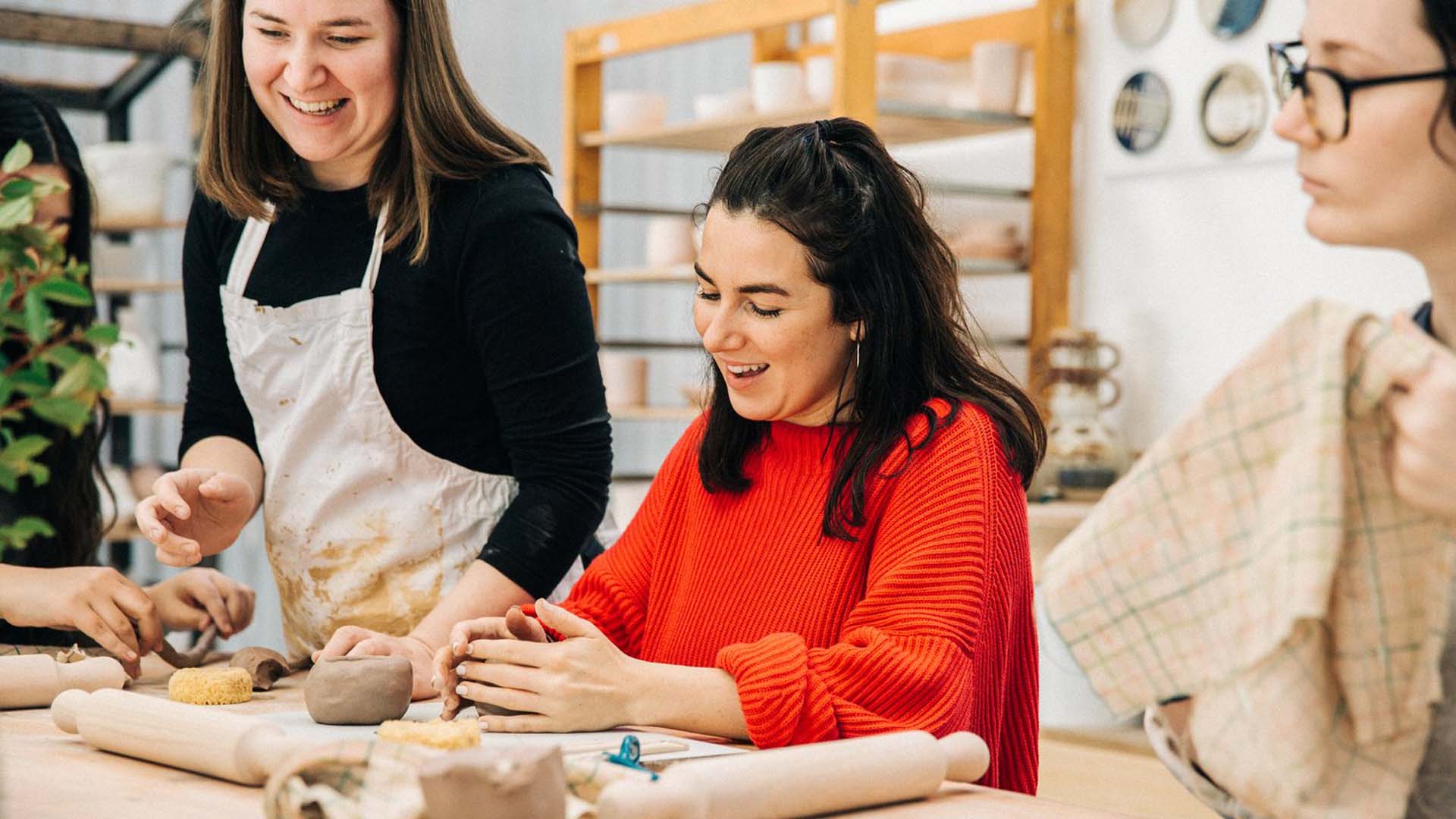 Group of women making clay at Clay Bisque Studios