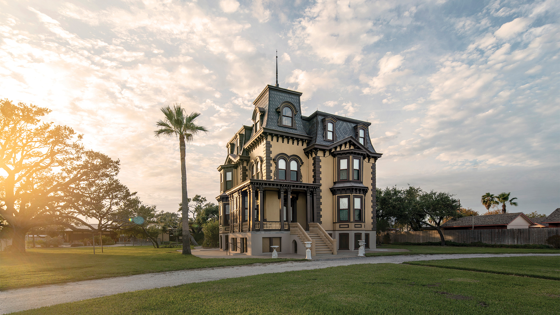 Fulton Mansion State Historical Site surrounded by lush grass and trees