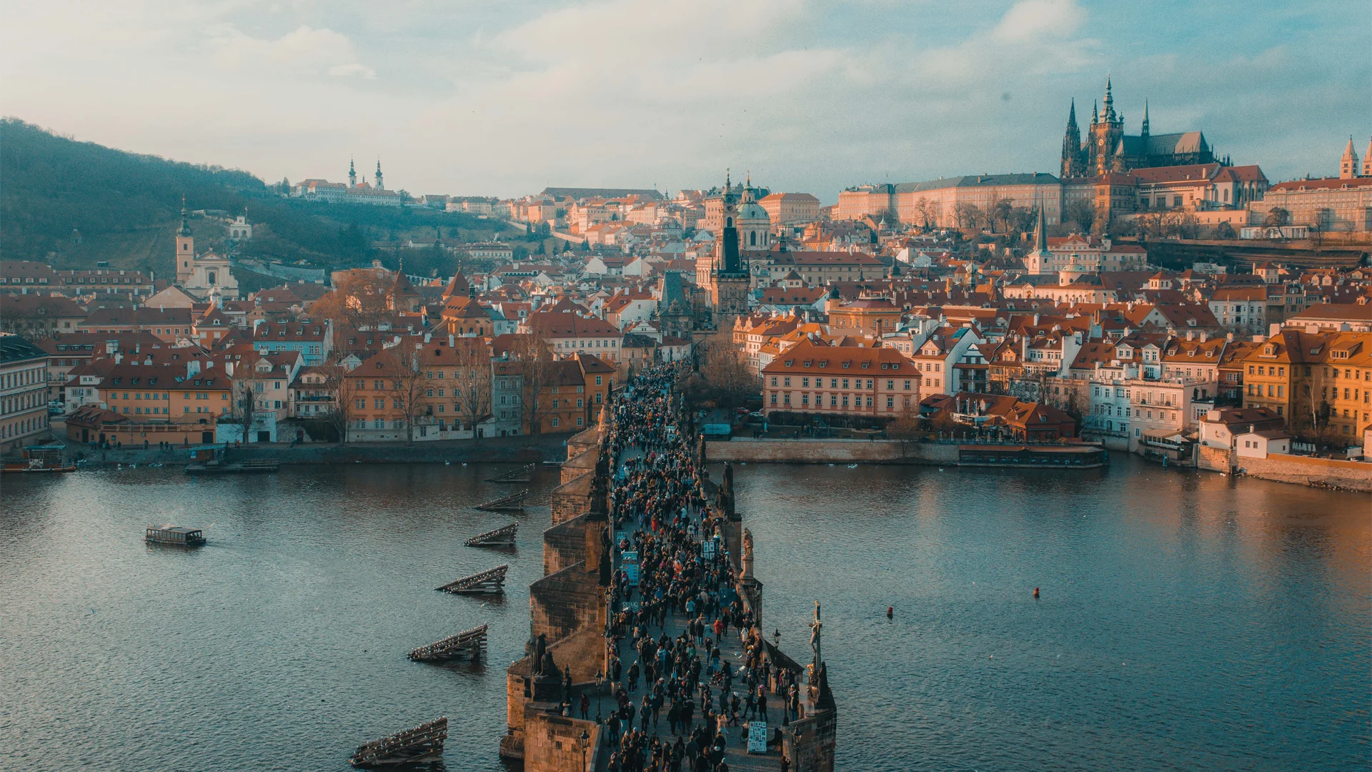 People crossing on the bridge in Prague