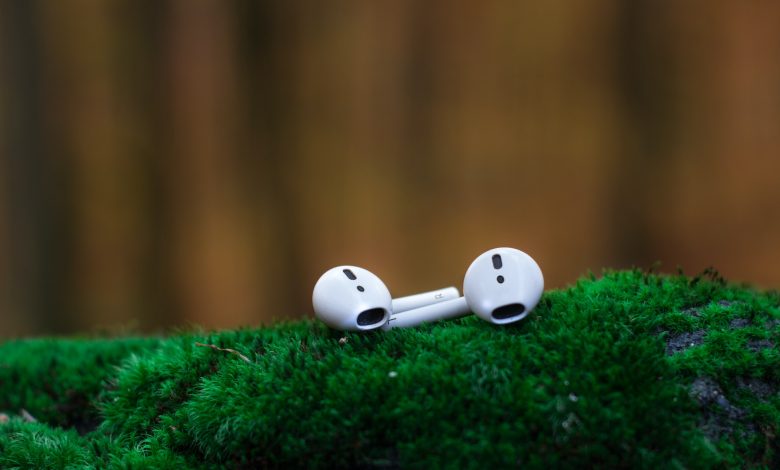 airpods on green grass