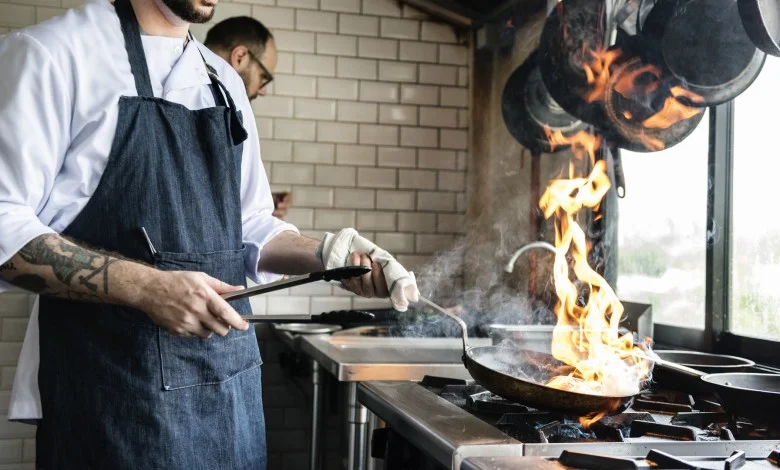 Chef cooking food in a restaurant kitchen