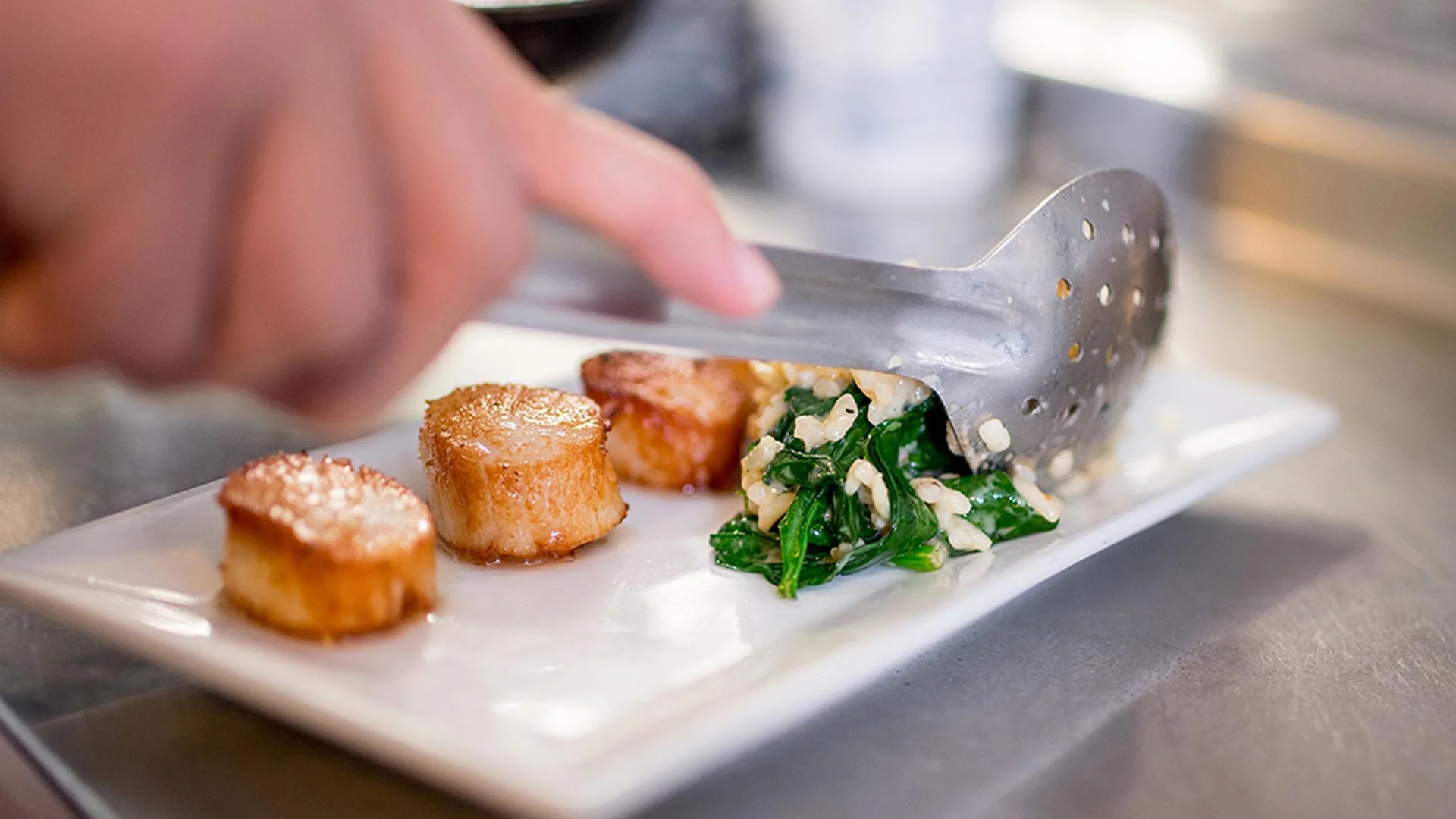 Chef preparing food at Tisha’s Fine Dining