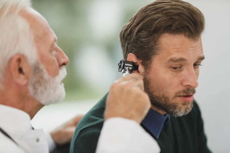 Doctor Examining Ears of a Man