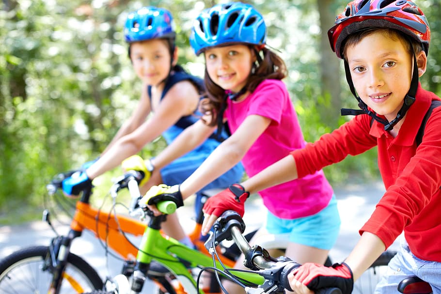 kids on bike wearing helmet