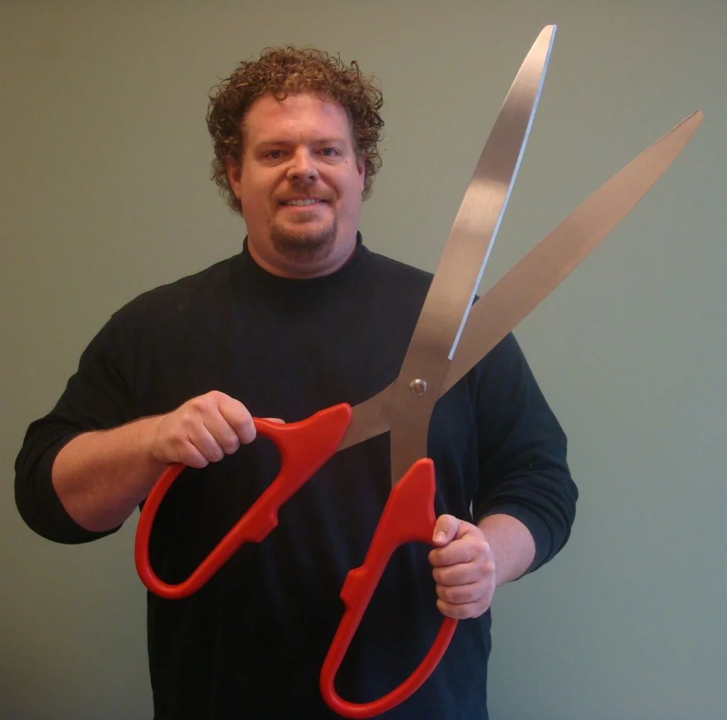 Man Holding Big Scissors