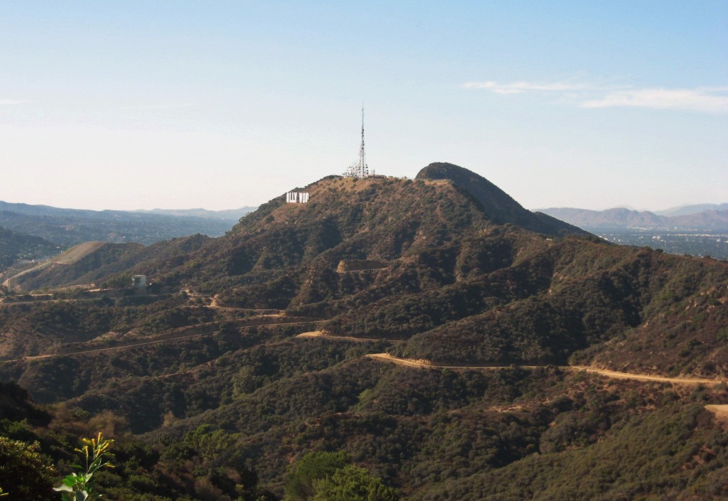 The Hollywood sign on Mount Lee in Griffith Park. Cahuenga Peak is behind Mount Lee. This photo shows the narrowness of the ridge between the Los Angeles basin on the left, and the San Fernando Valley on the right.