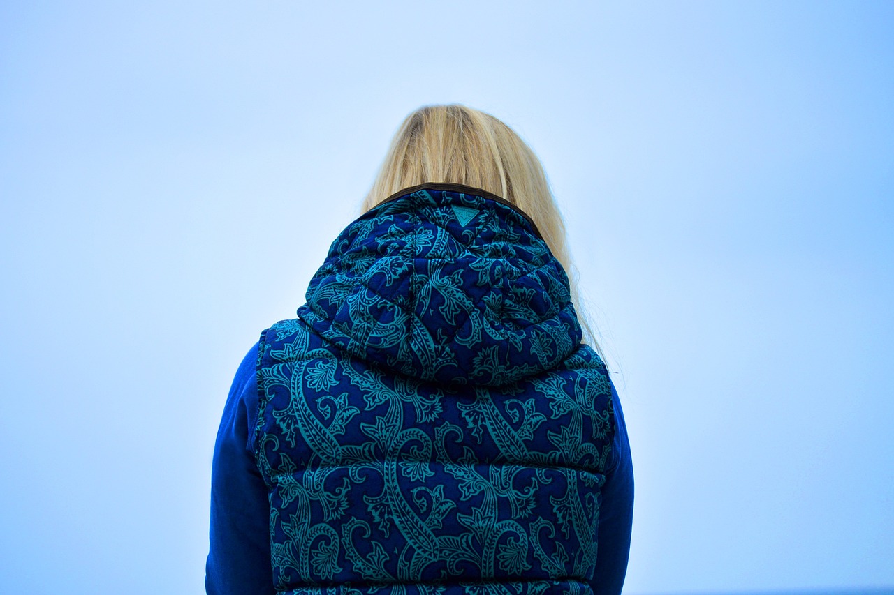 Woman wearing colorful vest